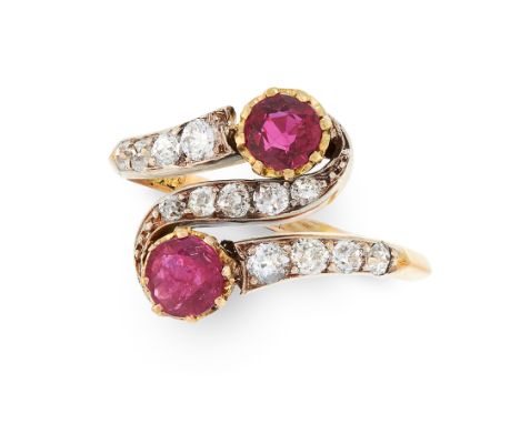 AN ANTIQUE RUBY AND DIAMOND TOI ET MOI RING in 18ct yellow gold, set with two round cut rubies in a twisted border set with o