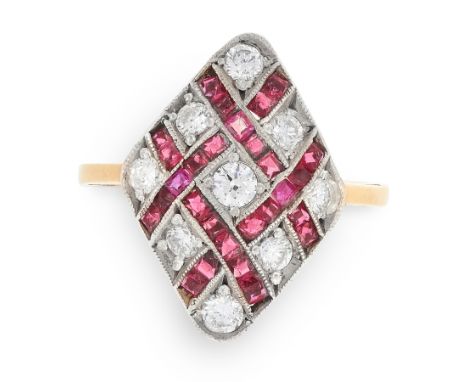 A RUBY AND DIAMOND DRESS RING in 18ct yellow gold, the kite shaped face set with alternating round cut diamonds and step cut 