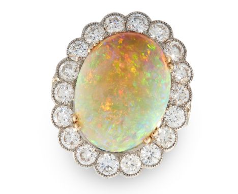 AN OPAL AND DIAMOND CLUSTER RING in white gold or platinum, set with an oval cabochon opal in a scallop edged border, set wit