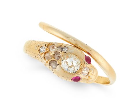 AN ANTIQUE DIAMOND AND RUBY SNAKE RING in high carat yellow gold, in the form of a snake, coiled around on itself, set with a