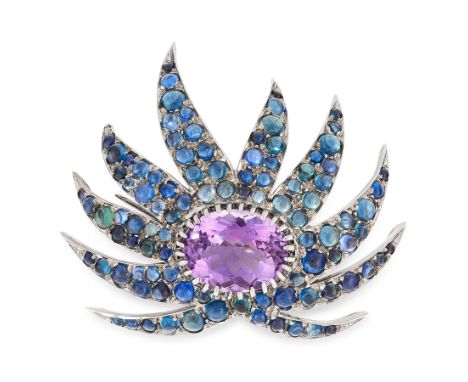 A VINTAGE AMETHYST AND SAPPHIRE BROOCH in 18ct white gold, in the form of an stylised starburst, set with an oval cut amethys