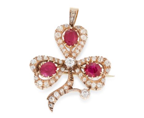 AN ANTIQUE RUBY AND DIAMOND CLOVER BROOCH / PENDANT in high carat yellow gold and silver, in the form of a clover set with th