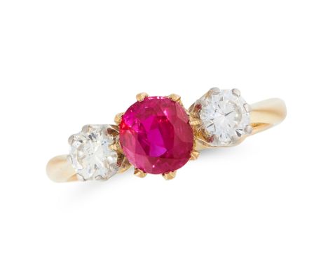 A RUBY AND DIAMOND THREE STONE RING in 18ct yellow gold, set with a round cut ruby of 0.70 carats between two round cut diamo