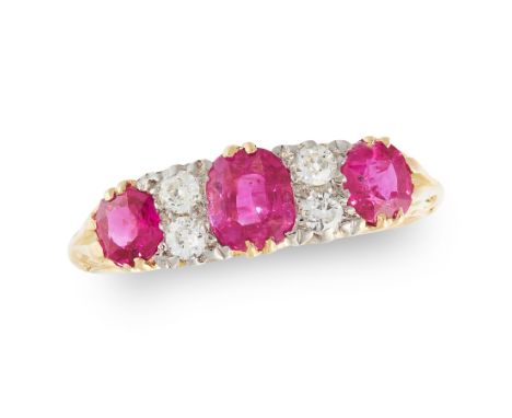 A RUBY AND DIAMOND DRESS RING in 18ct yellow gold, set with a trio of graduated cushion cut rubies and four old cut diamonds,