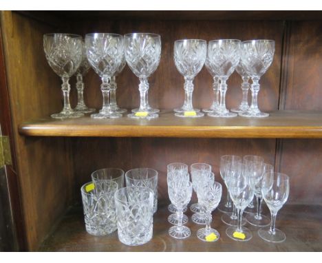 A set of six sherry glasses, with black cane stems, a set of four whisky tumblers and a set of glasses comprising six large, 