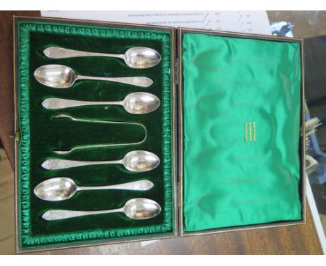 A silver sugar basin and cream jug, a cased set of silver teaspoons, a pair of glass specimen vases with silver rims