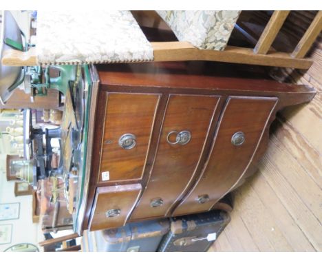 A George III style mahogany serpentine chest of drawers, with two short and two long drawers on outsplayed bracket feet, 74cm