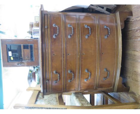 A crossbanded mahogany bowfront chest of drawers with brush slide and four long graduated drawers on bracket feet, 71cm wide