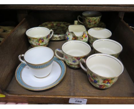 A Royal Winton Evesham pattern part tea service, with six teacups and saucers, four tea plates and milk jug and a Coalport Sa