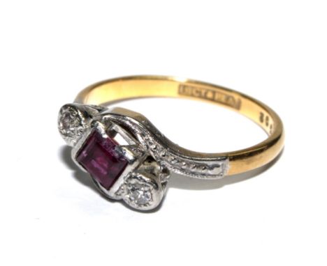 A ruby and diamond ring set in 18 carat gold