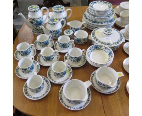 A Midwinter Spanish Garden pattern dinner service including two teapots, coffee pot, teawares and two sauceboats