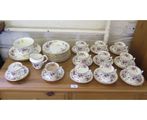 An Edwardian part tea service, with gilded purple floral decoration (39 pieces)