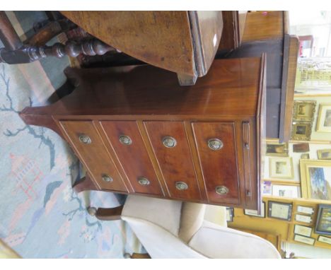 A mahogany chest of drawers, with brush slide and four drawers on outsplayed bracket feet, 48cm high