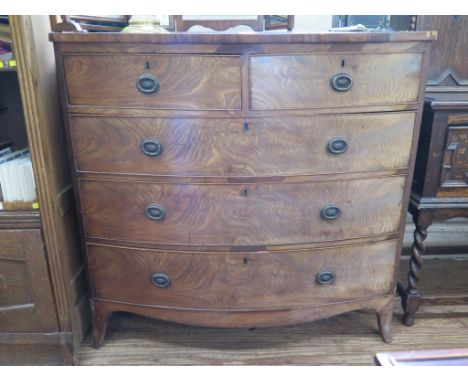 A 19th century mahogany bowfront chest of drawers, with two short and three long graduated drawers on outsplayed bracket feet