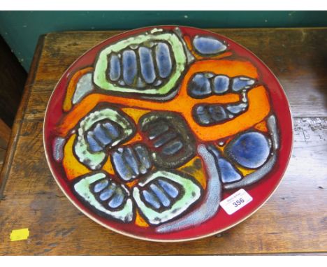 A Poole Pottery charger in green, blue and orange 36.5cm diameter