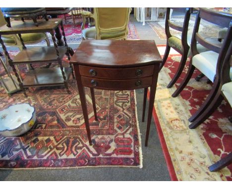 A George III revival line inlaid mahogany bow front lamp table of small proportions the two drawers over square tapering legs