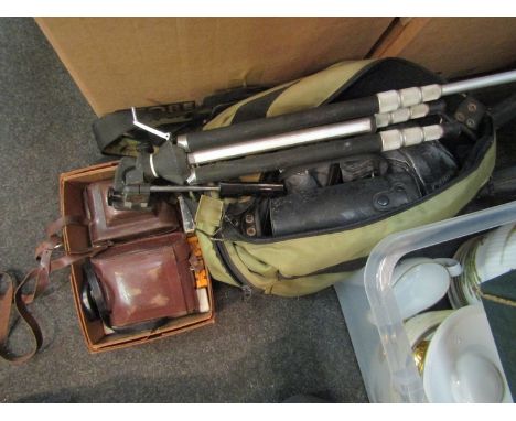 A camera case containing an A-I SLR camera, zoom lens, tripod etc.