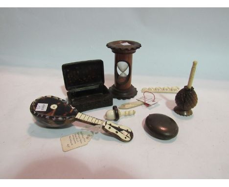 A selection of natural material novelties including an Oriental carved horn snuff box, a mother-of-pearl gaming counter as a 