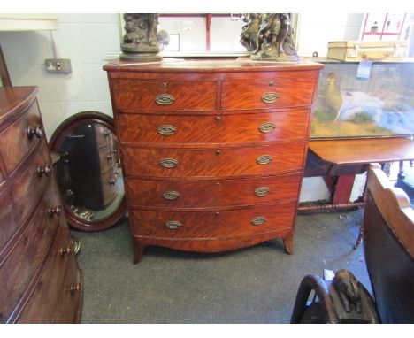 A flame mahogany two over four drawer bow front chest of drawers on bracket feet, oval plate handles, 120cm x 105cm x 50cm