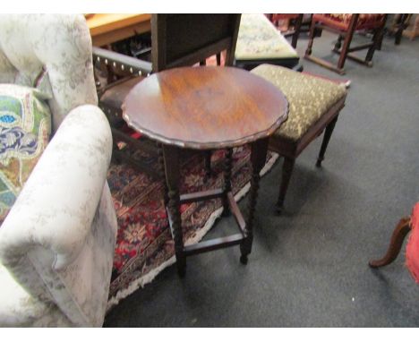 Circa 1920 an oak pie crust edge circular top lamp table on barley twist supports