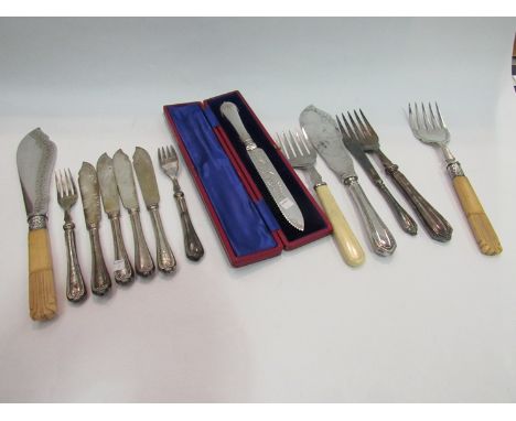 A silver handled cake knife in case and associated silver handled flatware and serving knives