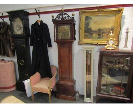 An 18th Century longcase clock with square 10½" brass face, Roman numerals, two train movement with calendar aperture, in oak