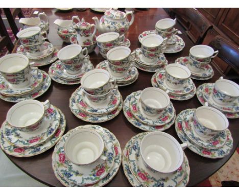 A large collection of Booths Floradora teaware including teapot, sugar and cream jugs, over 20 teacup and saucers
