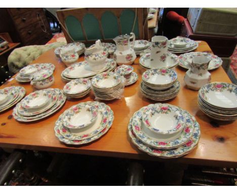 A large collection of Booths Floradora dinnerware including five vegetable tureens, meat dishes, jugs, soup cups etc.