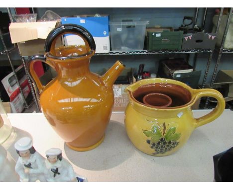 A pottery jug with integral ice compartment together with a French pottery Cruche wine pitcher, 30cm tall