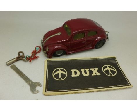 A tin-plate Dux clockwork VW Beetle, with leaflet, key and small tool marked Dux