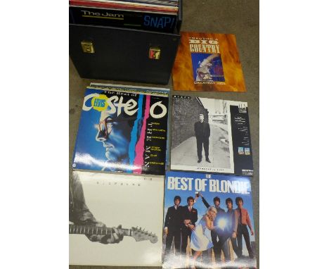 A collection of LP records including Elvis Presley Troubles, Judas Priest, Journey and Iron Maiden Number of The Beast pictur