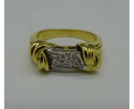 An 18ct yellow gold ring set with six diamonds, 6.9g, L