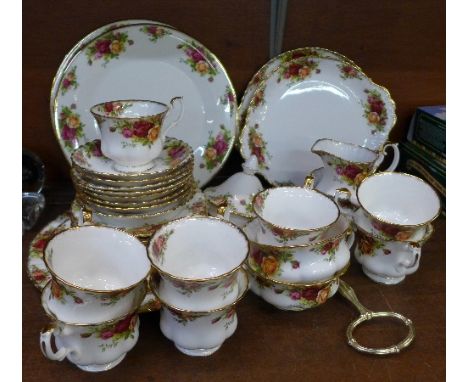 Royal Albert Old Country Roses china, comprising eight cups and saucers, nine side plates, two cake plates, a cake stand, cre