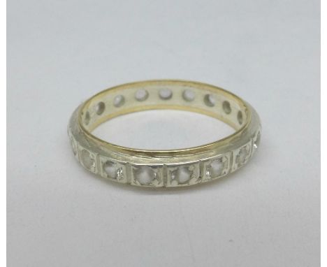 A 9ct gold and silver, white stone eternity ring, P