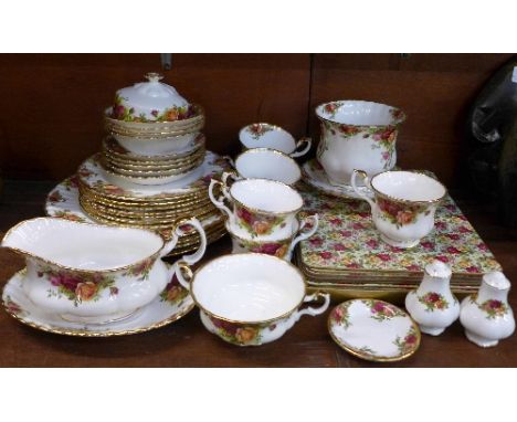 A collection of Royal Albert Old Country Roses china and place mats including four dinner plates, seven medium plates, seven 