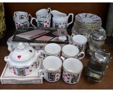 A Staffordshire coffee set decorated with playing cards and King and Queen novelty table lighters