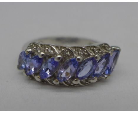 A limited edition silver, tanzanite and white topaz ring, with certificate, O