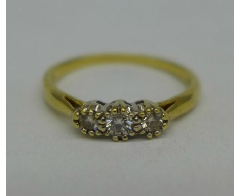 An 18ct gold and three stone diamond ring, 2.9g, Q