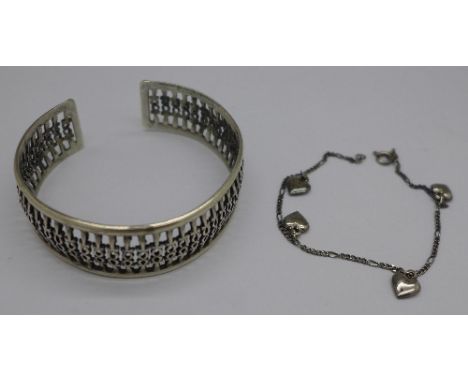 A silver cuff bangle and a silver bracelet