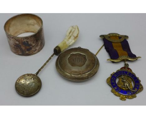 A silver lodge medal, a silver compact a/f, a napkin ring and a spoon