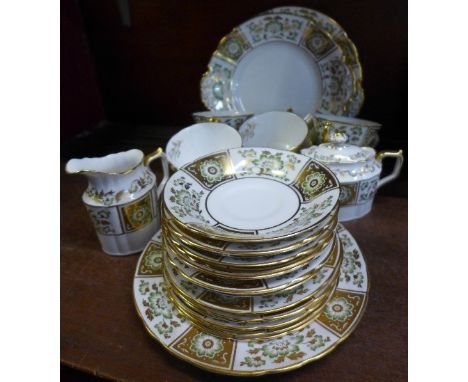 A Royal Crown Derby Green Derby Panel part tea set, comprising eight cups and saucers, six side plates, sugar bowl, two cake 