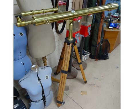 A Vintage Broadhurst brass astronomical telescope, on adjustable wooden tripod stand 