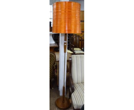A mid-century teak standard lamp and shade 