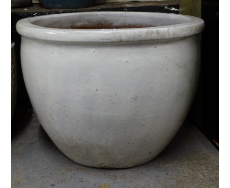 A large cream glazed terracotta circular garden planter, W64cm 