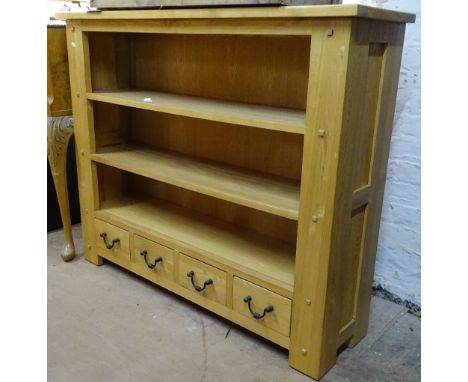 A modern light oak floor standing open bookcase, with drawers to the base, W120cm, H98cm 