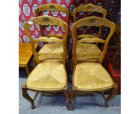 A set of 4 French oak ladder-back and rush-seated dining chairs 