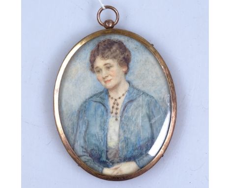 A framed oval watercolour portrait "study in blue", by Mrs J C Ashwell, height 3" 
