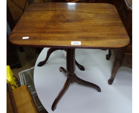 A Georgian mahogany tilt-top table on tripod base, a Victorian mahogany tilt-top table on tripod base, and a mahogany torcher