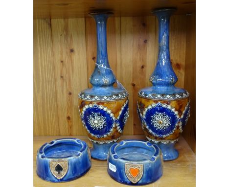 A pair of Royal Doulton tube lined vases, 12.25", and a pair of Doulton ashtrays with playing card motifs 