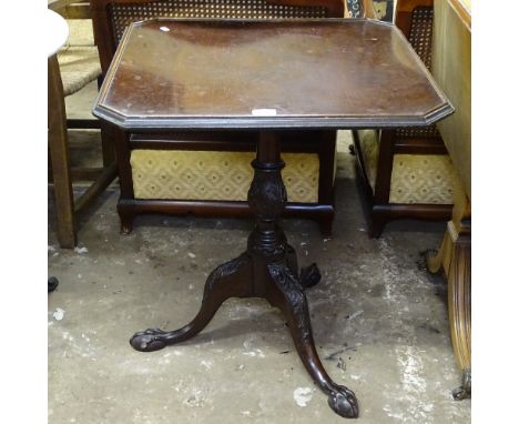 A 19th century mahogany tilt-top table, with galleried top, raised on a carved tripod base 